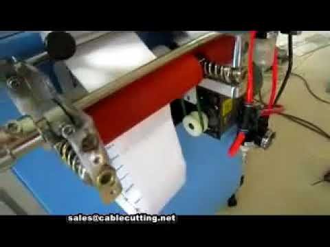 Macchina per taglio etichette tessili in raso bianco ad ultrasuoni